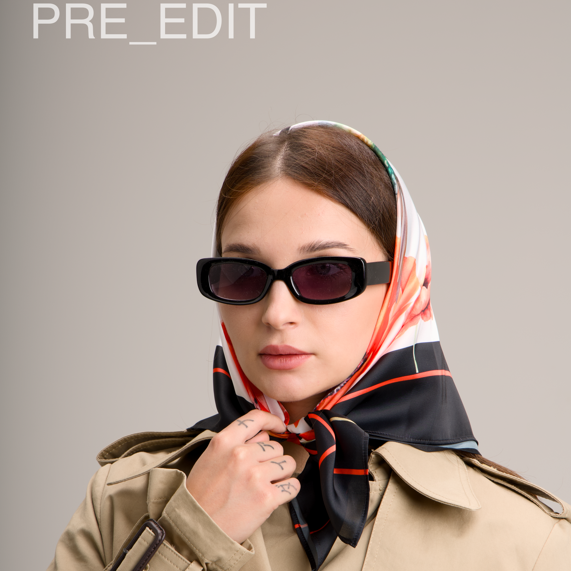 Person wearing a beige trench coat and colorful headscarf with sunglasses, labeled 'PRE_EDIT'.